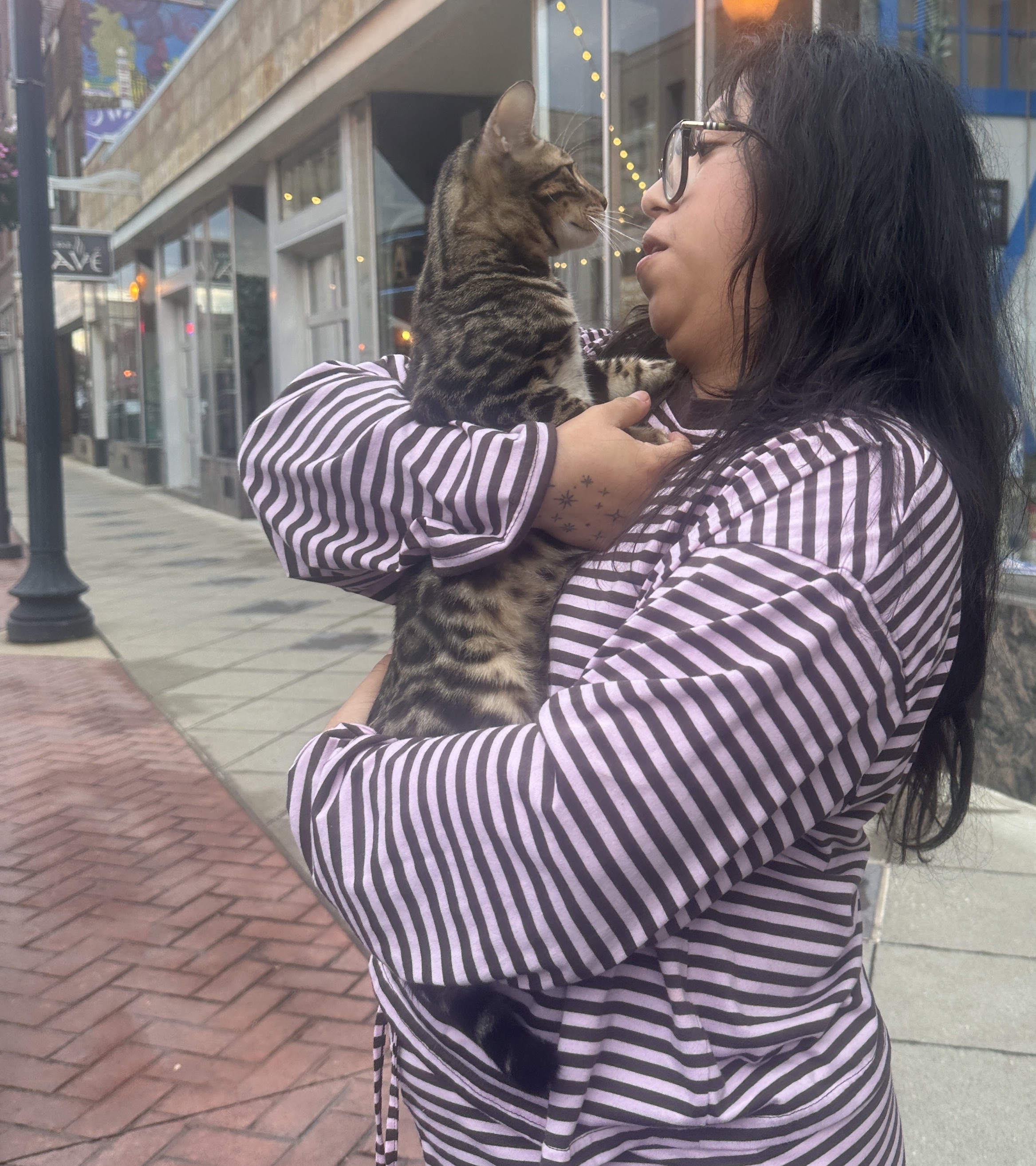 Kelly holding Bleu, her new Bengal kitten, on pickup day